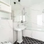 Chambre Double Superieure bathroom with black and white tiles and a sink at the Hotel 34B