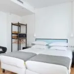 Chambre communicante de l’hôtel 3 étoiles Palm du groupe Astotel à Paris, idéale pour les familles ou groupes