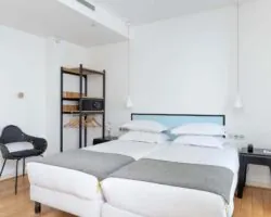 Chambre communicante de l’hôtel 3 étoiles Palm du groupe Astotel à Paris, idéale pour les familles ou groupes