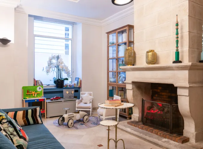 Reception area at the Malte Hotel in Paris with elegant décor, soft lighting and a warm, welcoming atmosphere