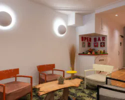 Lobby des 3-Sterne-Hotels George in Paris mit eleganten Farben, poppiger und verspielter Dekoration sowie einer raffinierten und einladenden Atmosphäre.