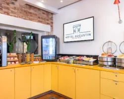 Salle de petit-déjeuner de l’hôtel Augustin à Paris