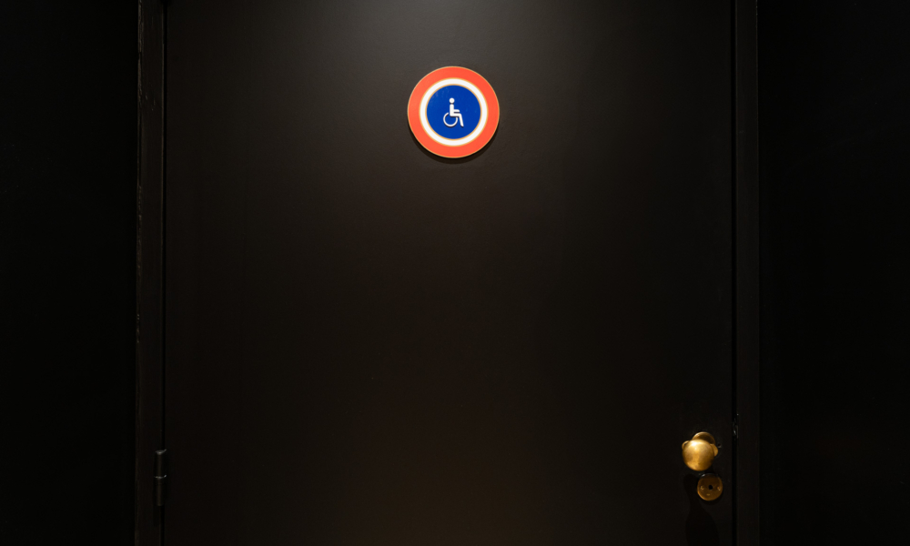 Clear and consistent signage at Hotel 34B Astotel indicating accessible toilets.